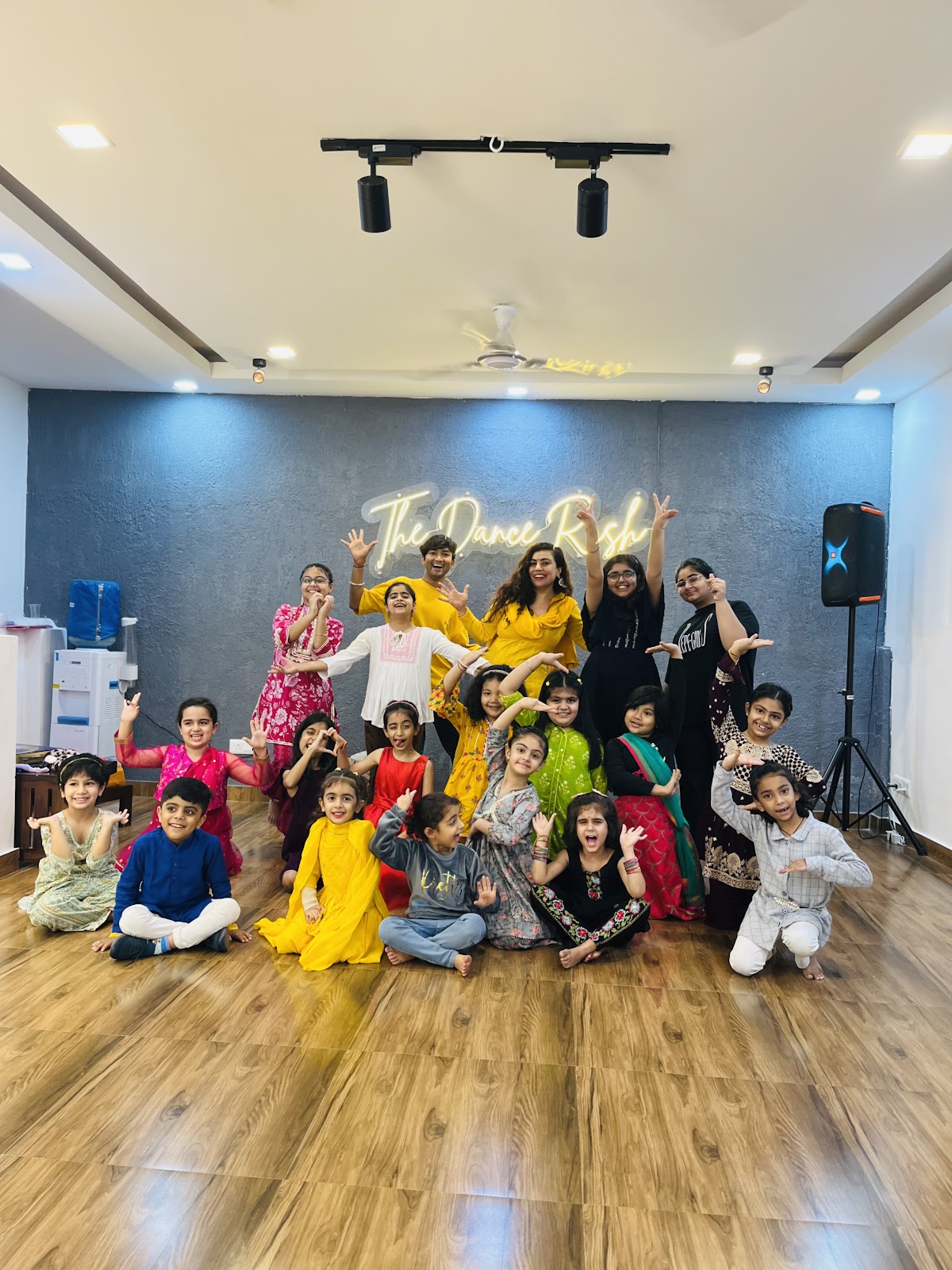 Children and instructor celebrating at The Dance Rush Studio